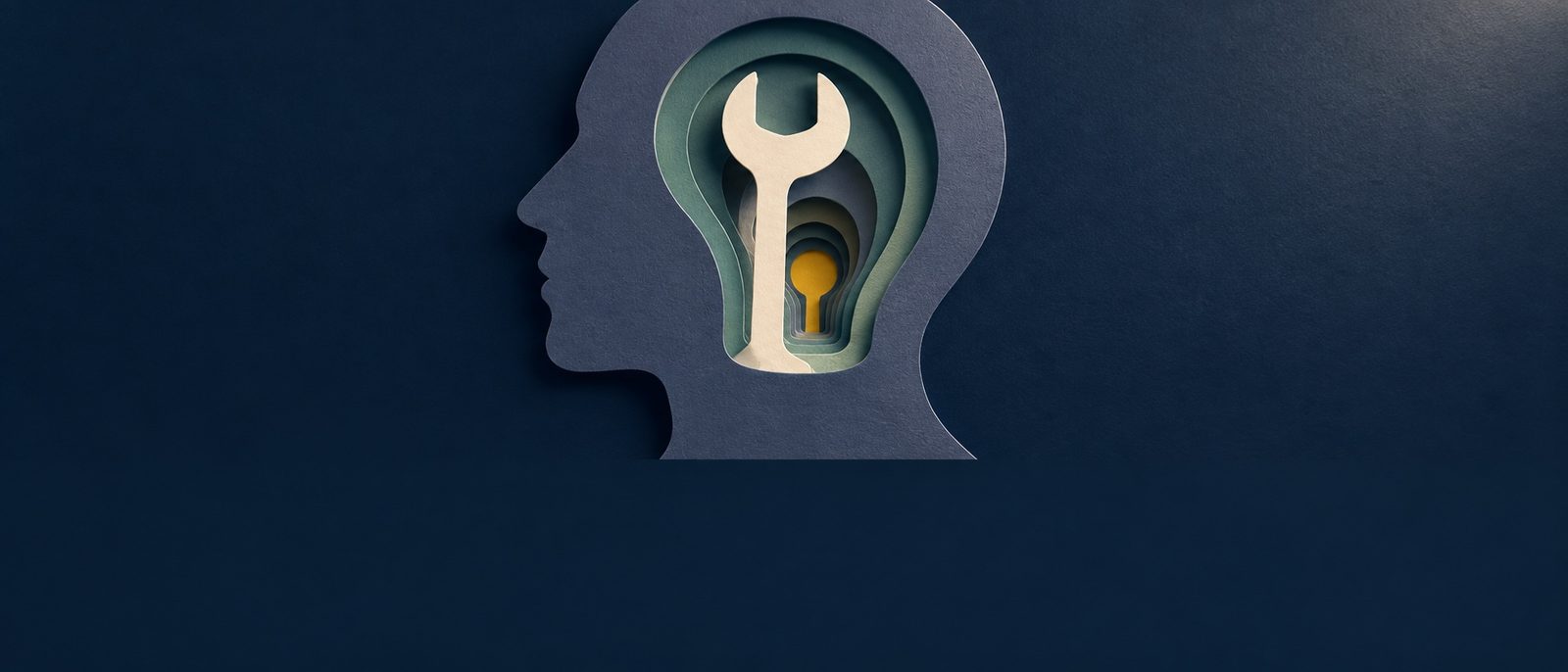 A layered paper profile contains a tool and a small light, representing human understanding of AI.