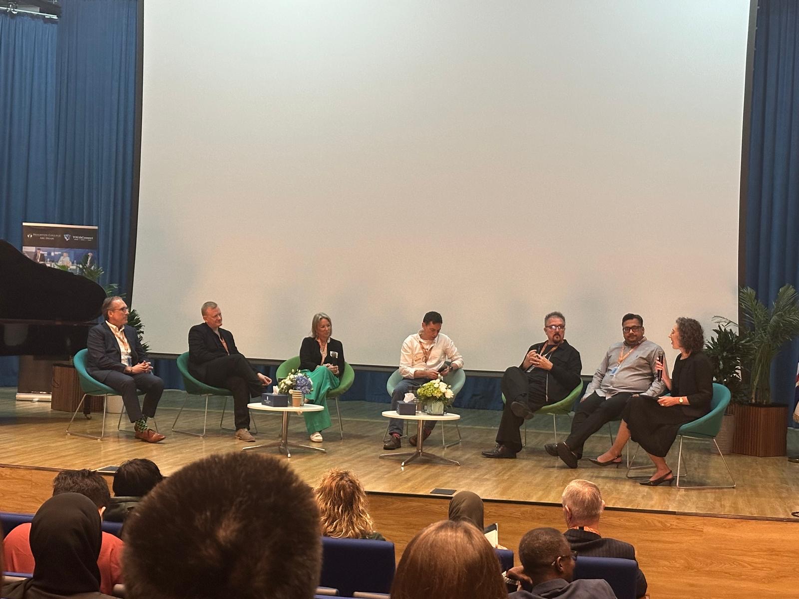 The Expertise Shift panel on stage at YOUth Connect Abu Dhabi, with audience members in the foreground.